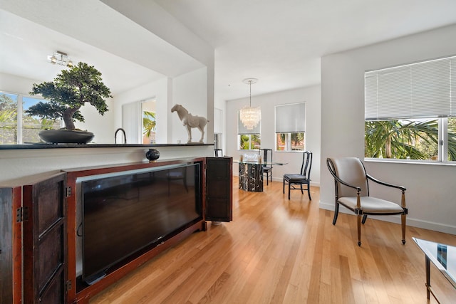 11011 Legacy Ln Unit 306, Palm Beach Gardens, FL 33410 - bar with healthy amount of natural light, light wood-style floors, pendant lighting, and baseboards