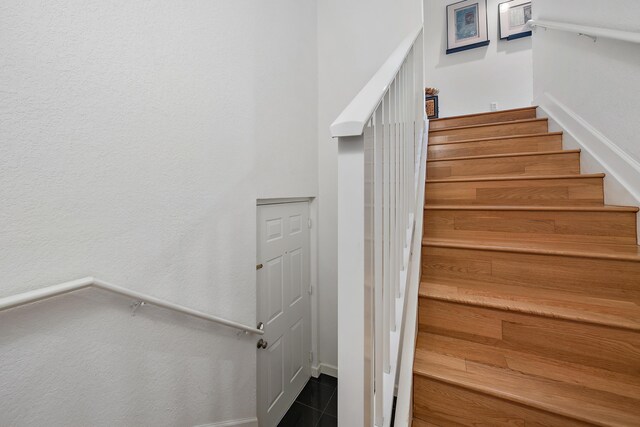 11011 Legacy Ln Unit 306, Palm Beach Gardens, FL 33410 - staircase with baseboards and tile patterned floors