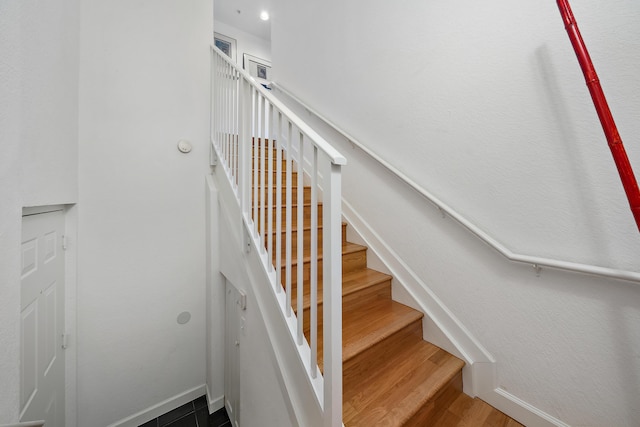 11011 Legacy Ln Unit 306, Palm Beach Gardens, FL 33410 - stairway featuring wood finished floors and baseboards