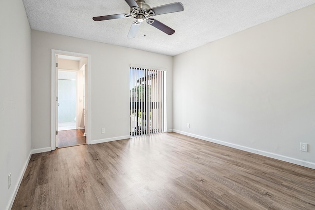 22924 Ironwedge Dr, Boca Raton, FL 33433 - unfurnished room featuring wood finished floors, a textured ceiling, ceiling fan, and baseboards