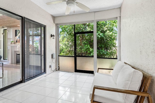 22924 Ironwedge Dr, Boca Raton, FL 33433 - sunroom with a textured wall, plenty of natural light, ceiling fan, and tile patterned floors