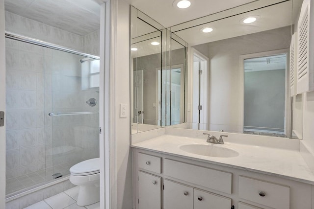 full bath featuring toilet, a stall shower, vanity, tile patterned flooring, and recessed lighting