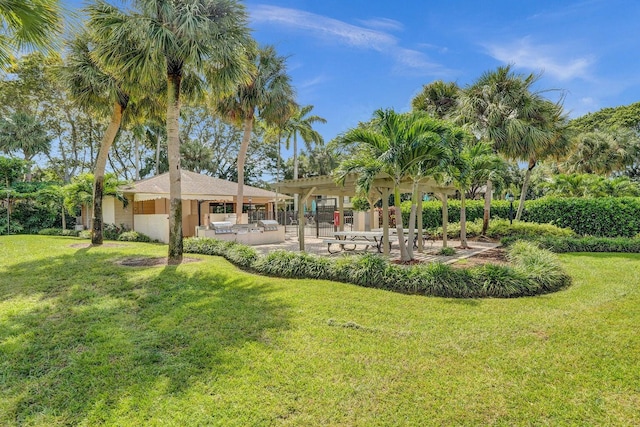 view of grassy yard with a patio area