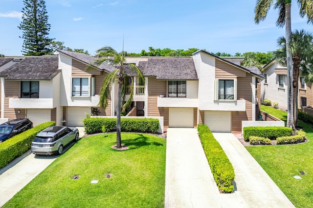 22924 Ironwedge Dr, Boca Raton, FL 33433 - multi unit property with a garage, driveway, a front yard, and stucco siding
