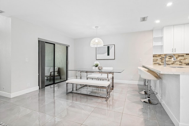 22924 Ironwedge Dr, Boca Raton, FL 33433 - dining space with baseboards, recessed lighting, and light marble finish flooring