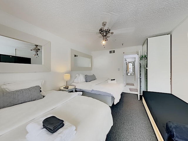 3100 Parkway Blvd Unit 310, Kissimmee, FL 34747 - bedroom featuring carpet flooring, a textured ceiling, and ceiling fan