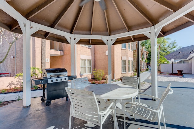 3100 Parkway Blvd Unit 310, Kissimmee, FL 34747 - view of patio with a grill, a gazebo, outdoor dining space, and fence