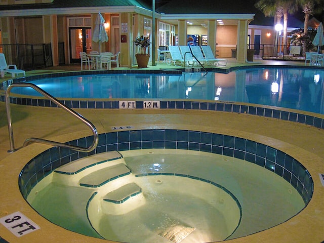 3100 Parkway Blvd Unit 310, Kissimmee, FL 34747 - indoor pool with an in-ground hot tub and fence