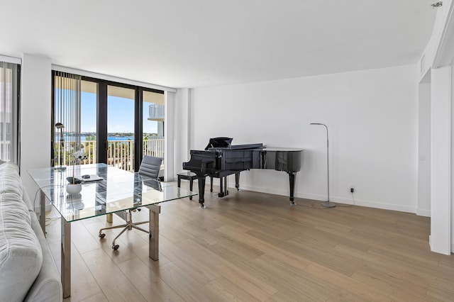 3360 S Ocean Blvd Unit 5Fii, Palm Beach, FL 33480 - office space with light wood-type flooring, a wall of windows, and baseboards