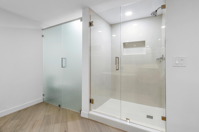 3360 S Ocean Blvd Unit 5Fii, Palm Beach, FL 33480 - bathroom featuring wood finished floors and a stall shower
