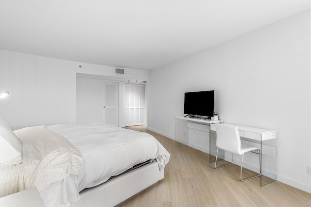 3360 S Ocean Blvd Unit 5Fii, Palm Beach, FL 33480 - bedroom with light wood finished floors, a desk, and baseboards