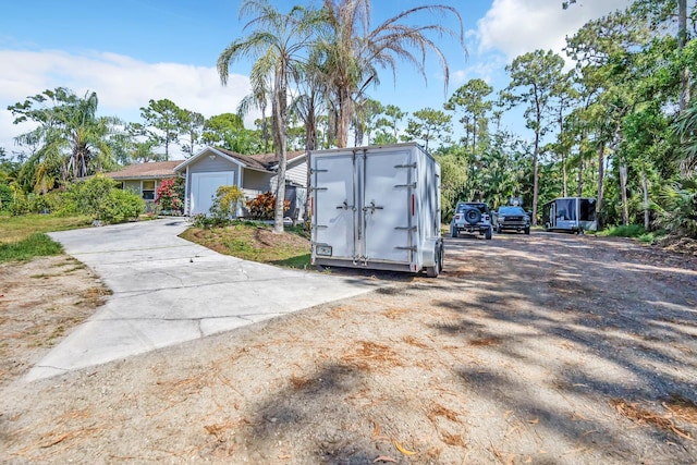 view of front of property with a shed and an outbuilding