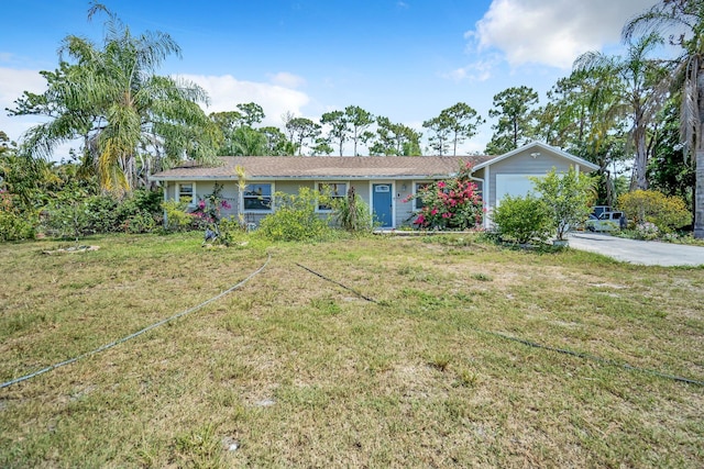 single story home with an attached garage and a front yard