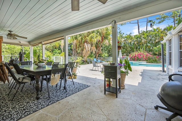 view of patio with outdoor dining area and ceiling fan