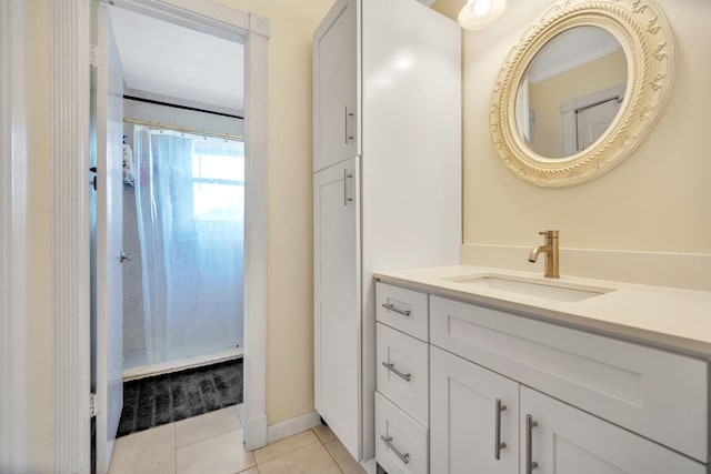 bathroom featuring tile patterned floors, curtained shower, and vanity