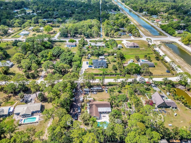 aerial view of property's location featuring a nearby body of water