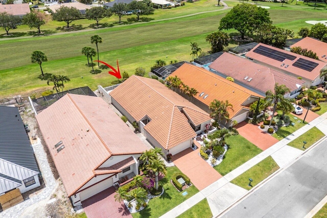 aerial view of residential area featuring a golf club