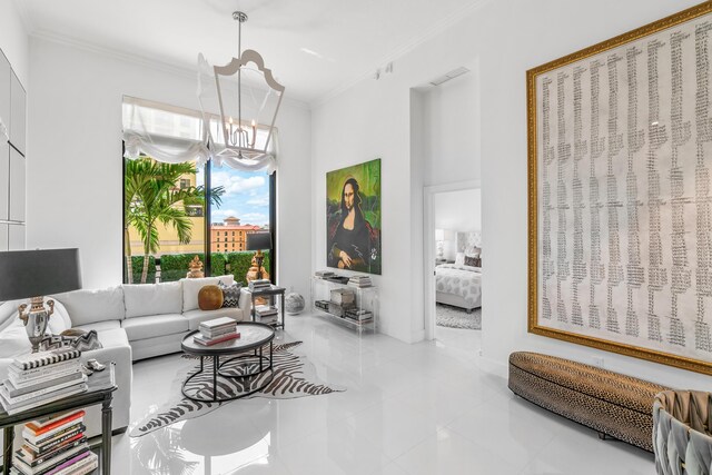 living room with a chandelier, ornamental molding, and baseboards