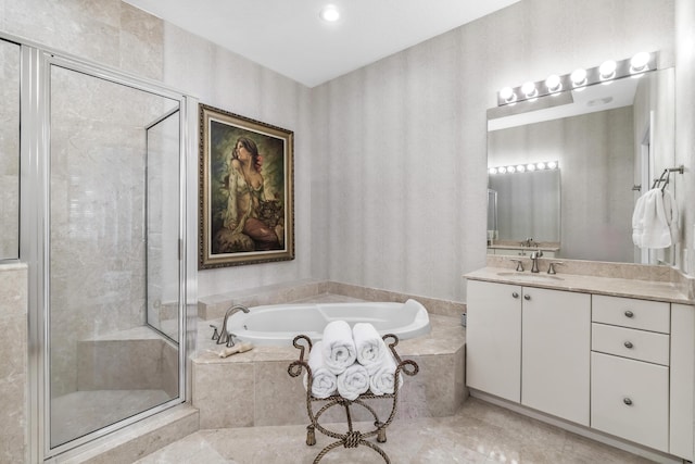 full bath featuring a bath, a stall shower, vanity, and tile patterned floors