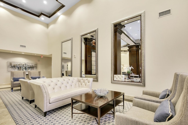 common area with recessed lighting and a towering ceiling
