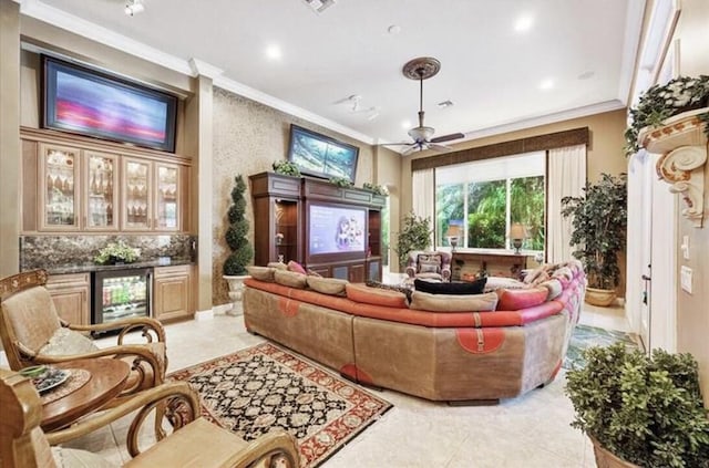 living area with crown molding, wine cooler, a ceiling fan, recessed lighting, and light tile patterned floors