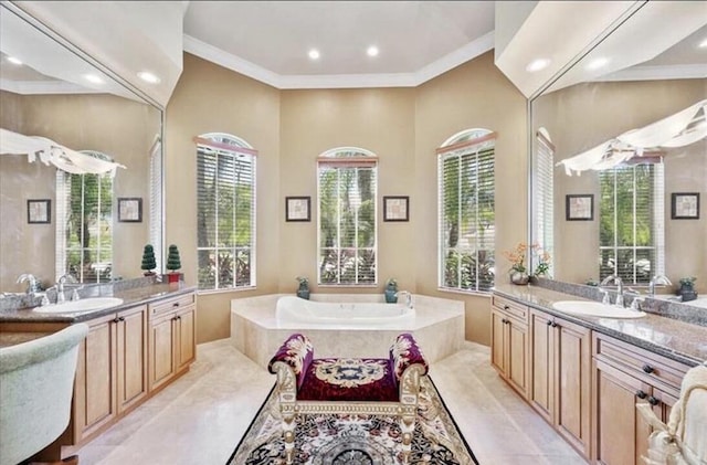 full bathroom featuring recessed lighting, a garden tub, two vanities, and ornamental molding