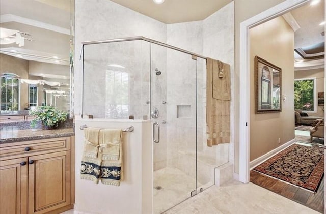 bathroom featuring a shower stall, baseboards, vanity, recessed lighting, and crown molding