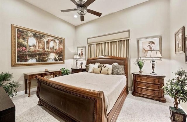 bedroom featuring light carpet, recessed lighting, baseboards, and ceiling fan