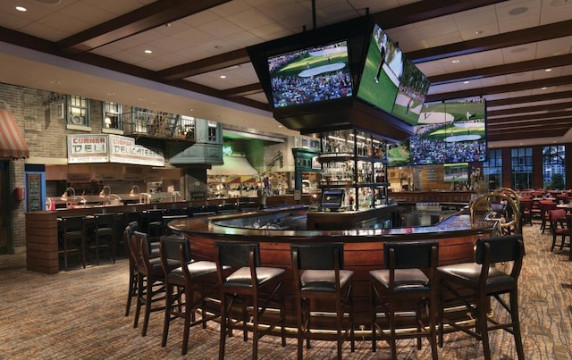 community bar area featuring beamed ceiling and carpet