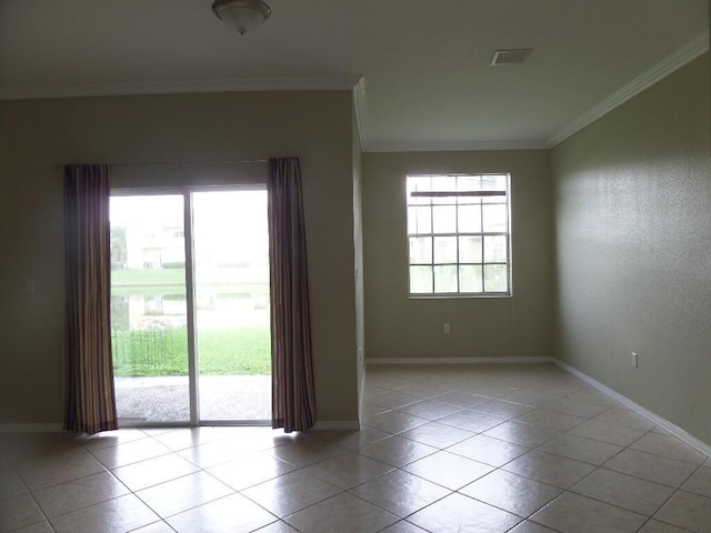 unfurnished room featuring crown molding, light tile patterned floors, and baseboards