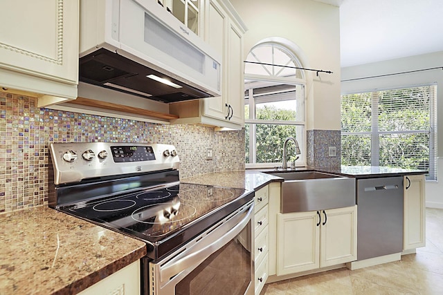 227 Shorewood Way, Jupiter, FL 33458 - kitchen with appliances with stainless steel finishes, a sink, stone counters, and tasteful backsplash
