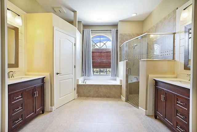 227 Shorewood Way, Jupiter, FL 33458 - full bathroom with a stall shower, two vanities, a bath, and tile patterned floors