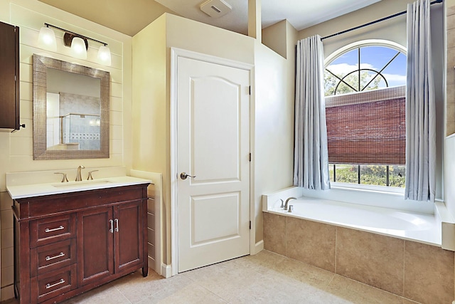 227 Shorewood Way, Jupiter, FL 33458 - full bathroom featuring tile patterned floors, a garden tub, vanity, and a shower