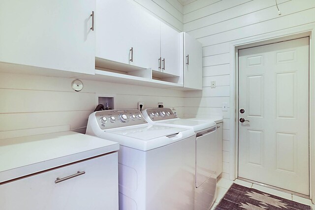 227 Shorewood Way, Jupiter, FL 33458 - washroom with cabinet space, washer and dryer, and wood walls