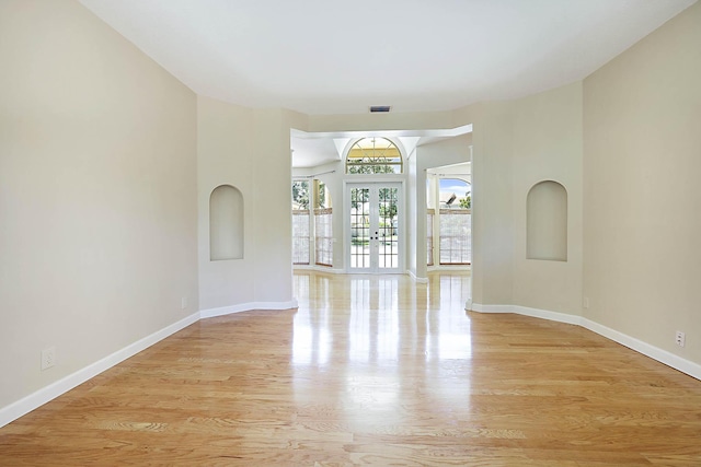 227 Shorewood Way, Jupiter, FL 33458 - spare room featuring wood finished floors, baseboards, and french doors