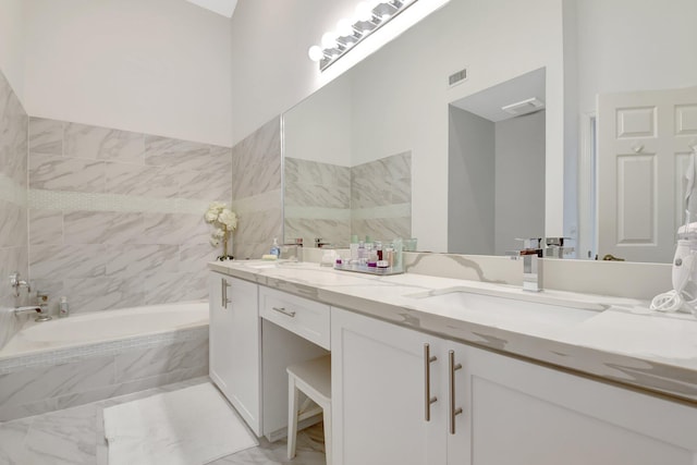 full bath featuring a garden tub and double vanity