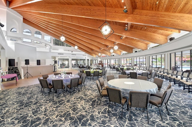 dining space featuring wooden ceiling, high vaulted ceiling, and beamed ceiling