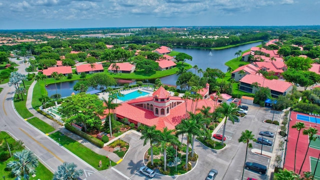 bird's eye view of a nearby body of water and a pool