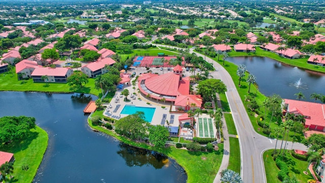 bird's eye view of a large body of water and a pool area