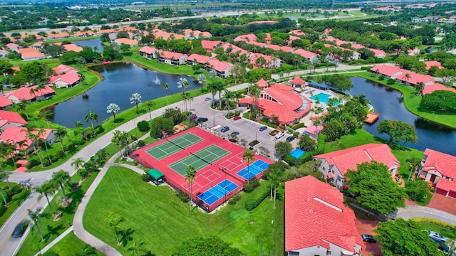 aerial view of residential area with a large body of water