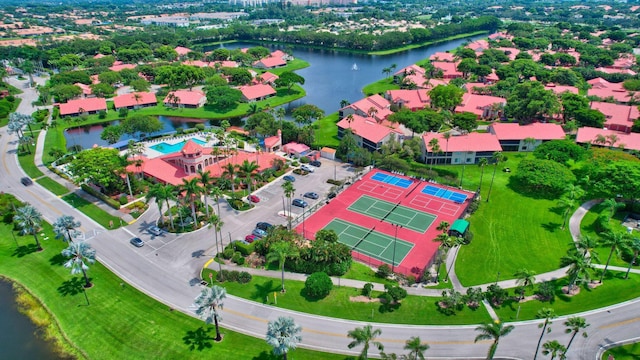 drone / aerial view of a large body of water and a pool