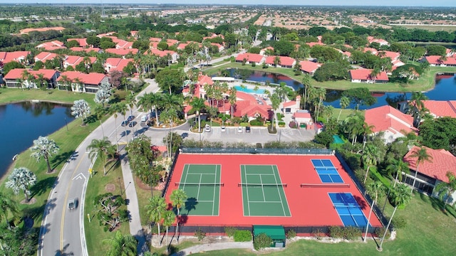 aerial view of property's location with a nearby body of water