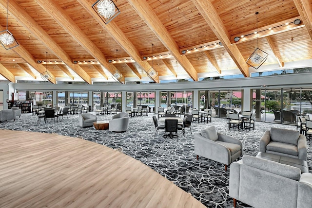 living area with high vaulted ceiling, beamed ceiling, wooden ceiling, and wood finished floors