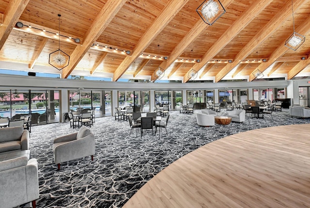 living room featuring high vaulted ceiling, beam ceiling, wood ceiling, wood finished floors, and rail lighting