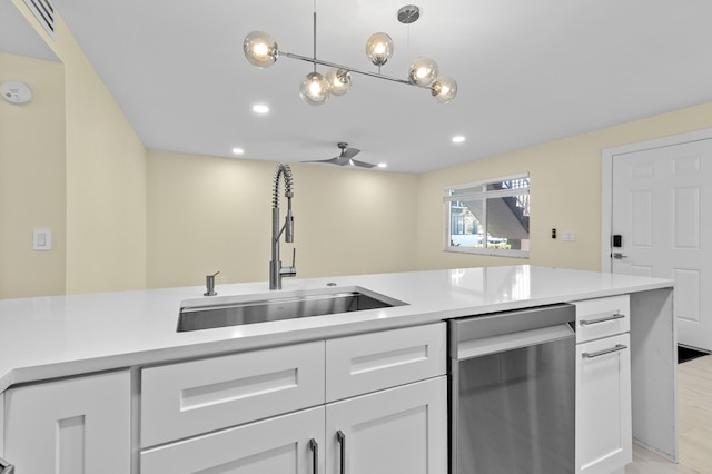 969 Normandy U, Delray Beach, FL 33484 - kitchen featuring dishwasher, a sink, light countertops, white cabinets, and recessed lighting