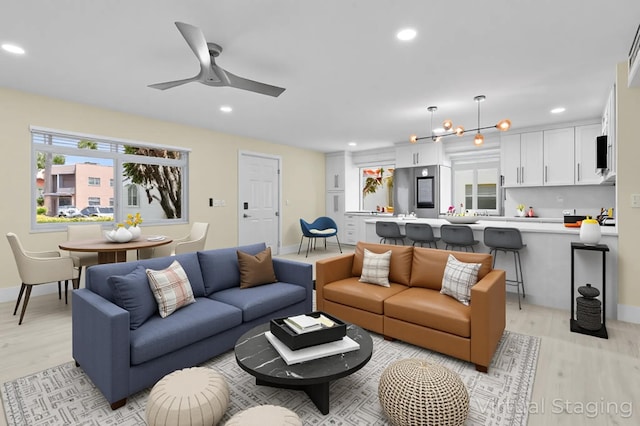 969 Normandy U, Delray Beach, FL 33484 - living room with light wood finished floors, recessed lighting, ceiling fan, and baseboards