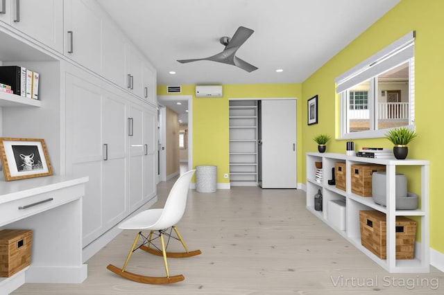 969 Normandy U, Delray Beach, FL 33484 - sitting room with ceiling fan, light wood-style floors, recessed lighting, a wall mounted AC, and baseboards