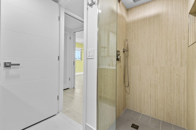 969 Normandy U, Delray Beach, FL 33484 - bathroom featuring a tile shower and tile patterned flooring
