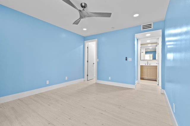 969 Normandy U, Delray Beach, FL 33484 - unfurnished bedroom featuring light wood finished floors, recessed lighting, baseboards, ceiling fan, and ensuite bath
