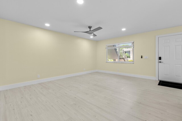 969 Normandy U, Delray Beach, FL 33484 - unfurnished living room featuring light wood finished floors, a ceiling fan, recessed lighting, and baseboards